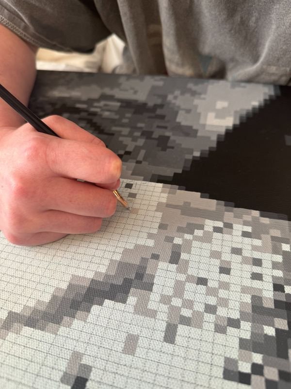 Close-up of pixel painting technique